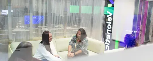 people_colleagues_talking_in_office_on_sofas