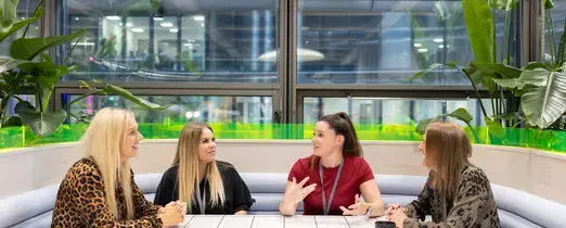 people_colleagues_talking_together_in_communal_area