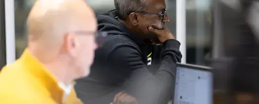 people_colleagues_working_at_laptops_in_office