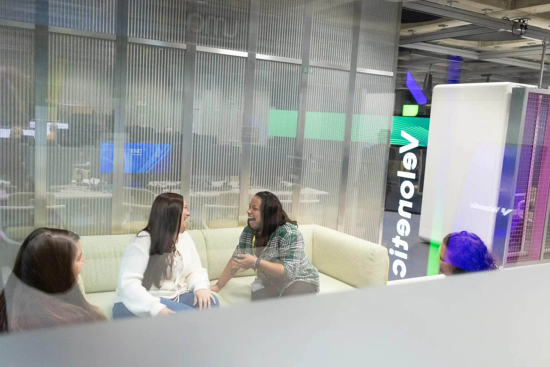 people_colleagues_talking_on_sofas_in_office