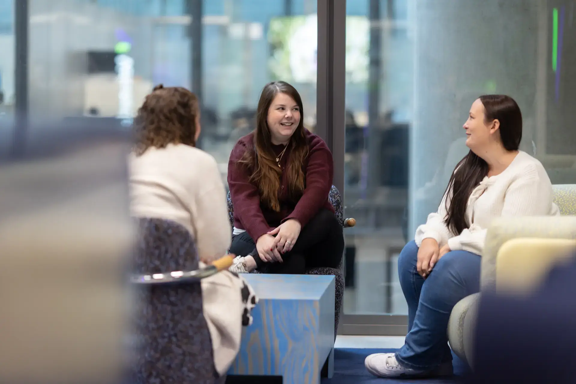 people_colleagues_talking_sitting_in_office