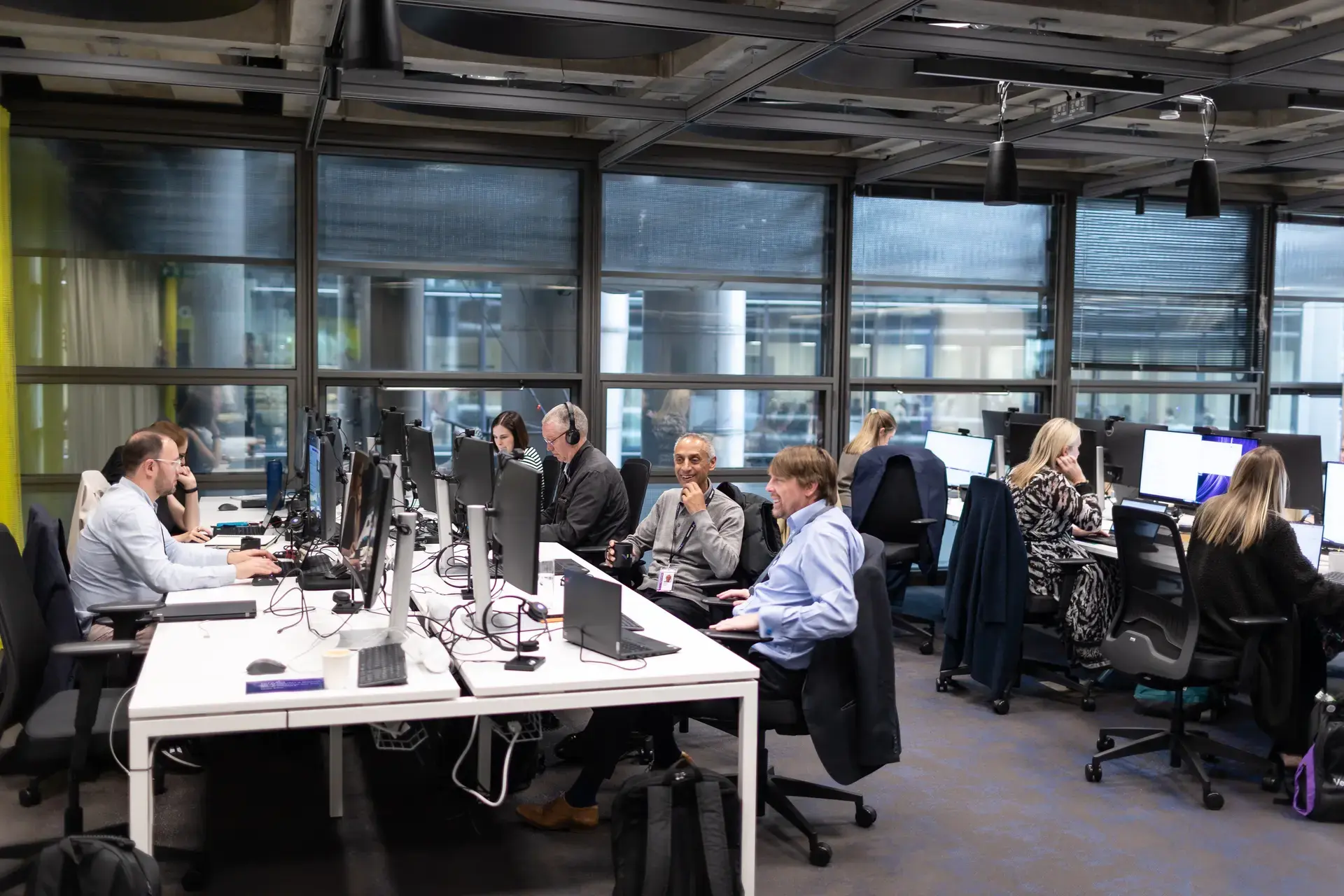 Colleagues working on laptops in office
